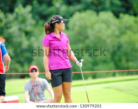 SINGAPORE - MARCH 3: American Danielle Kang watched her ball landing during HSBC Women\'s Champions at Sentosa Golf Club Serapong Course March 3, 2013 in Singapore