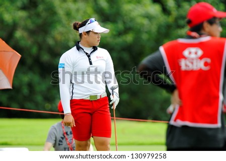 SINGAPORE - MARCH 3: Ariya Jutanugarn from Thailand watched her ball landing during HSBC Women\'s Champions at Sentosa Golf Club Serapong Course March 3, 2013 in Singapore