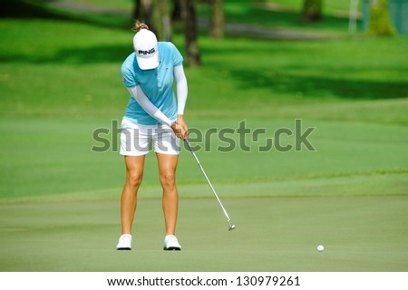 SINGAPORE - MARCH 3: Azahara Munoz putting at the green during HSBC Women\'s Champions at Sentosa Golf Club Serapong Course March 3, 2013 in Singapore