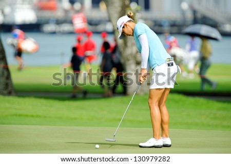 SINGAPORE - MARCH 3: Azahara Munoz putting at the green during HSBC Women\'s Champions at Sentosa Golf Club Serapong Course March 3, 2013 in Singapore