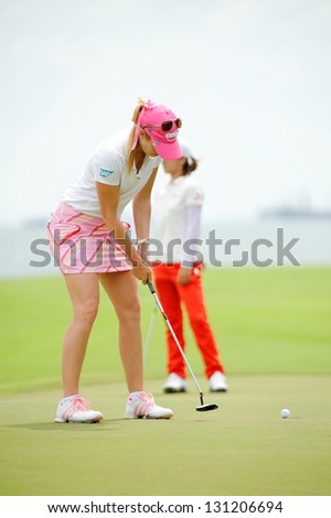 SINGAPORE - MARCH 3: American Paula Creamer putting at the green during HSBC Women\'s Champions at Sentosa Golf Club Serapong Course March 3, 2013 in Singapore