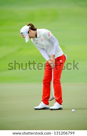 SINGAPORE - MARCH 3: Korean Na Yeon Choi putting at the green during HSBC Women\'s Champions at Sentosa Golf Club Serapong Course March 3, 2013 in Singapore