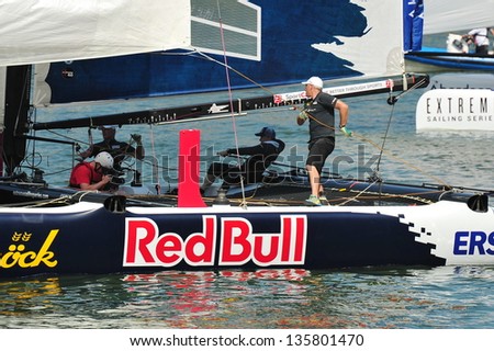 SINGAPORE - APRIL 13: Crew of Red Bull Sailing Team adjusting sails at the Extreme Sailing Series race at Marina Bay Reservoir April 13, 2013 in Singapore