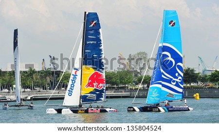 SINGAPORE - APRIL 13: Red Bull Sailing Team racing The Wave, Muscat at the Extreme Sailing Series race at Marina Bay Reservoir April 13, 2013 in Singapore