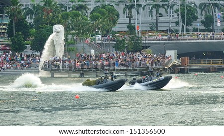 SINGAPORE - JULY 20: Republic of Singapore Navy demonstrating their rigid hull inflatable boats during National Day Parade (NDP) Rehearsal 2013 on July 20, 2013 in Singapore
