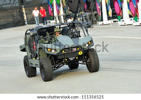 SINGAPORE - JULY 20: Singapore Armed Forces (SAF) demonstrating its new Light Strike Vehicle (LSV) MkII during National Day Parade (NDP) Rehearsal 2013 on July 20, 2013 in Singapore