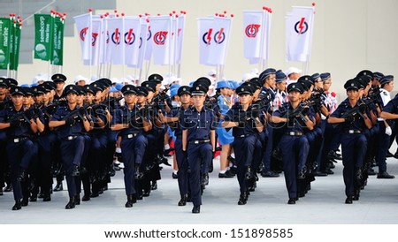 SINGAPORE - JULY 20: Singapore Police Force marching during National Day Parade (NDP) Rehearsal 2013 on July 20, 2013 in Singapore