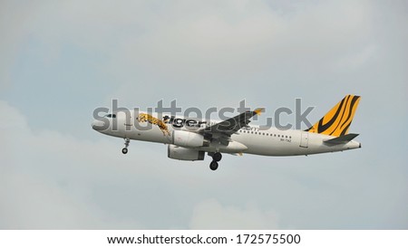 SINGAPORE - DECEMBER 25:  A Tigerair Airbus A320 taking off at Changi Airport on December 25, 2013 in Singapore