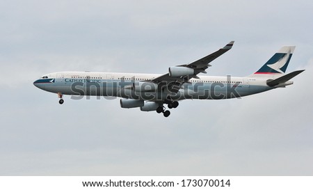 SINGAPORE - DECEMBER 25: Cathay Pacific Airbus A340 landing at Changi Airport on December 25, 2013 in Singapore
