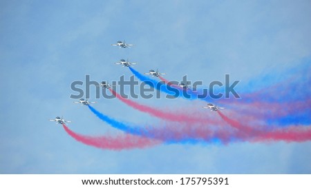 SINGAPORE - FEBRUARY 9: Aerobatic flying display by Black Eagles from the Republic of Korean Air Force (ROKAF) at Singapore Airshow February 9, 2014 in Singapore