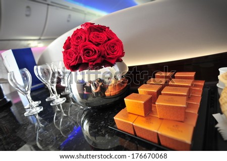 SINGAPORE - FEBRUARY 12: Flowers and chocolates to welcome passengers onboard the Qatar Airways Boeing 787-8 Dreamliner at Singapore Airshow February 12, 2014 in Singapore