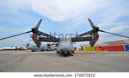 SINGAPORE - FEBRUARY 9: Bell Boeing MV-22 Osprey tilt rotor aircraft with vertical take-off and landing (VTOL) capability on display at Singapore Airshow February 9, 2014 in Singapore