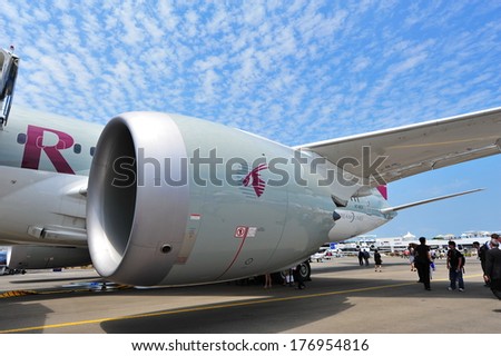 SINGAPORE - FEBRUARY 12: General Electric GEnx turbo fan engine powering Qatar Airways Boeing 787-8 Dreamliner at Singapore Airshow February 12, 2014 in Singapore