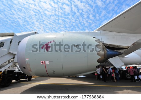SINGAPORE - FEBRUARY 12: General Electric GEnx turbo fan engine powering Qatar Airways Boeing 787-8 Dreamliner at Singapore Airshow February 12, 2014 in Singapore