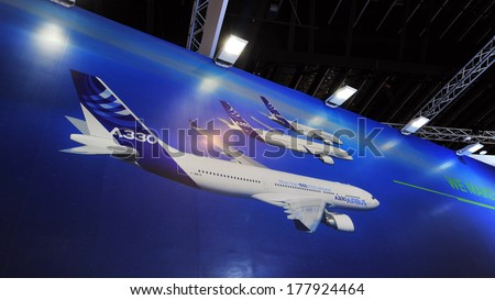 SINGAPORE - FEBRUARY 12: Large backdrop showing Airbus family of wide body passenger jets, the A330, A350 and A380 at Singapore Airshow February 12, 2014 in Singapore