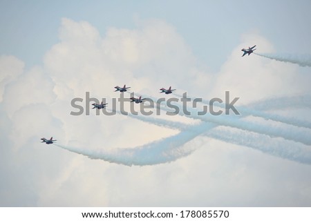 SINGAPORE - FEBRUARY 9: Aerobatic flying display by Republic of Singapore Air Force (RSAF) Black Knights at Singapore Airshow February 9, 2014 in Singapore