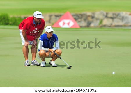 SINGAPORE - MARCH 2: Spanish player Azahara Munoz aiming at the green during HSBC Women\'s Champions at Sentosa Golf Club Serapong Course March 2, 2014 in Singapore