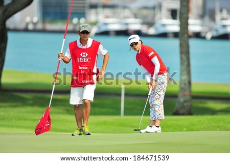 SINGAPORE - MARCH 2: Taiwanese player Teresa Lu aiming on the green during HSBC Women\'s Champions at Sentosa Golf Club Serapong Course March 2, 2014 in Singapore