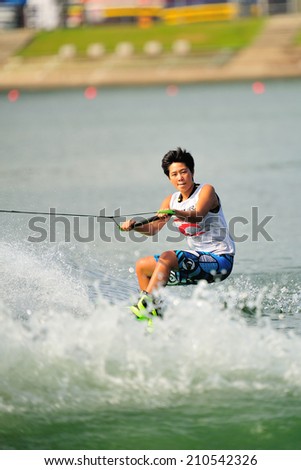 SINGAPORE - JULY 20: Athlete performing stunt during Rip Curl Singapore National Inter Varsity & Polytechnic Wakeboard Championship 2014 on July 20, 2014 in Singapore