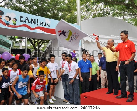 SINGAPORE - JANUARY 10: Minister Vivian Balakrishnan flagging off a run at the launch of the Singapore 2010 Youth Olympic Games logo January 10, 2009 in Singapore