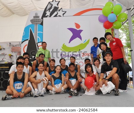 SINGAPORE - JANUARY 10: Group photo of Teo Ser Luck, Youth Olympic Games (YOG) Organizing Committee Chairman, Ng Ser Miang and athletes during Singapore YOG logo launch January 10, 2009 in Singapore