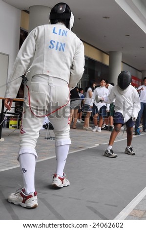SINGAPORE - JANUARY 10: Fencing demonstration prior to Singapore 2010 Youth Olympic Games logo launch ceremony January 10, 2009 in Singapore