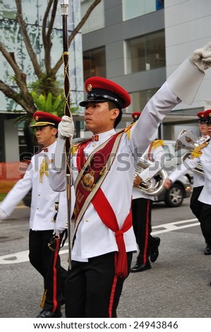 SINGAPORE - DECEMBER 07: Singapore Armed Forces Band B Drum Major signaling band to halt during President\'s changing of guards parade December 07, 2008 in Singapore