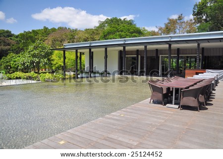 Outdoor dining place beside pond
