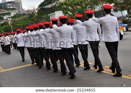 SINGAPORE - DECEMBER 07: Singapore Armed Forces contingent marching on public road during President\'s changing of guards parade December 07, 2008 in Singapore