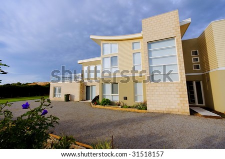 Exterior of modern private house with gravel driveway