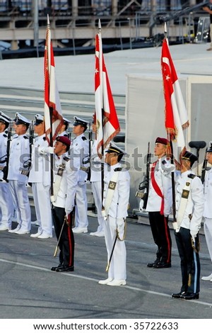 SINGAPORE - AUGUST 09: Military tri-service flag bearers at the Singapore National Day Parade 2009 August 09, 2009 in Singapore