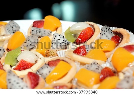 Variety of fruit tarts on a plate