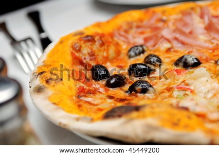 Traditional Italian thin crust pizza with various toppings