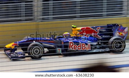 SINGAPORE - SEPTEMBER 26: Mark Webber racing in his Red Bull Racing car during 2010 Formula 1 Singapore Singtel Grand Prix on September 26, 2010 in Singapore