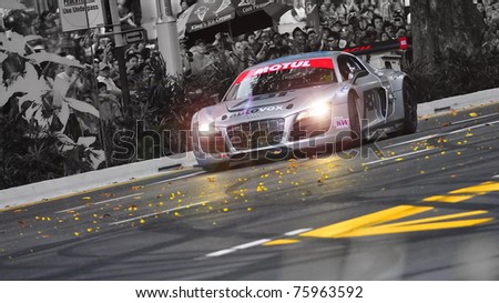 SINGAPORE - APRIL 24: Audi R8 LMS speeds down the road during Red Bull Speed Street Singapore on April 24, 2011 in Singapore.