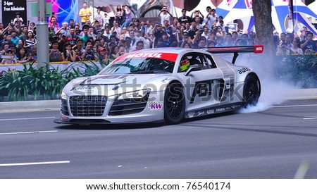 stock photo SINGAPORE APRIL 24 Audi R8 LMS performing burnouts during
