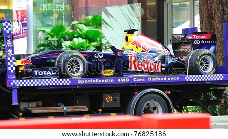 SINGAPORE - APRIL 24: Red Bull Racing F1 RB6 car being transported after Red Bull Speed Street Singapore on April 24, 2011 in Singapore.