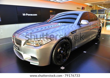 SINGAPORE - MAY 21: Unveiling the new BMW M5 Concept at Munich Automobiles BMW Service Centre Open House on May 21, 2011 in Singapore