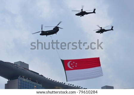 SINGAPORE - JUNE 18: Chinook flying Singapore flag during National Day Parade Singapore 2011 Combined Rehearsal on June 18, 2011 in Singapore.
