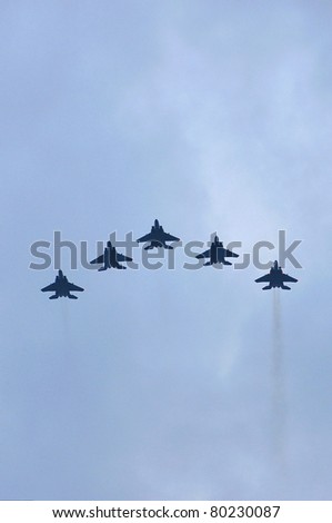 SINGAPORE - JUNE 18: Fleet of F-15SG performing fly past at National Day Parade Singapore 2011 Combined Rehearsal on June 18, 2011 in Singapore.