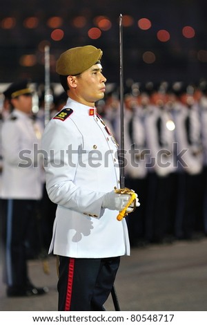 SINGAPORE - JUNE 25: Parade Commander standing at attention during National Day Parade Singapore 2011 Combined Rehearsal on June 25, 2011 in Singapore.