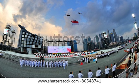 SINGAPORE - JUNE 25: Chinook helicopter flying Singapore national flag at National Day Parade Singapore 2011 Combined Rehearsal on June 25, 2011 in Singapore.