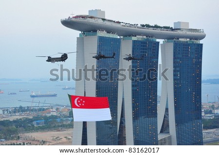 SINGAPORE - JULY 09: Singapore national flag fly past during National Day Parade Singapore 2011 Combined Rehearsal on July 09, 2011 in Singapore.