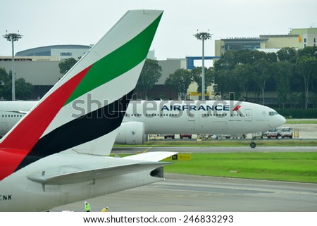 SINGAPORE - JANUARY 10: Air France Boeing 777-300ER taxiing past an Emirates Boeing 777-300ER at Changi Airport on January 10, 2015 in Singapore