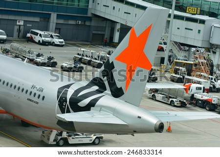 SINGAPORE - JANUARY 10:  Jetstar Asia Airbus 320 ready for push back at Changi Airport on January 10, 2015 in Singapore
