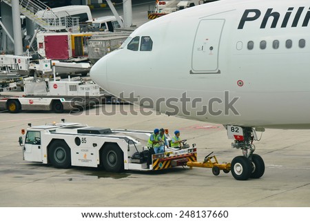 SINGAPORE - JANUARY 10: Philippines Airlines Airbus 330 being pushed back at Changi Airport on January 10, 2015 in Singapore