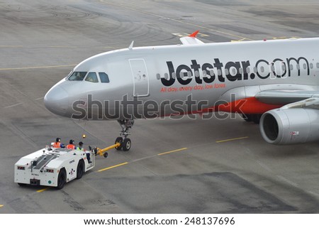 SINGAPORE - JANUARY 10:  Jetstar Asia Airbus 320 being pushed back for departure at Changi Airport on January 10, 2015 in Singapore