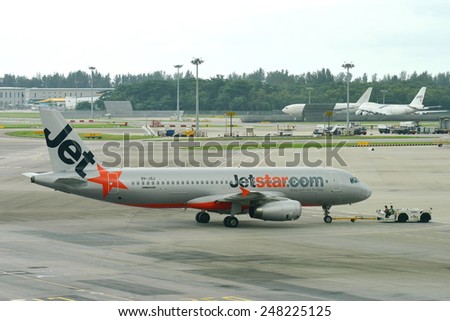 SINGAPORE - JANUARY 10:  Jetstar Asia Airbus 320 being pushed back at Changi Airport on January 10, 2015 in Singapore