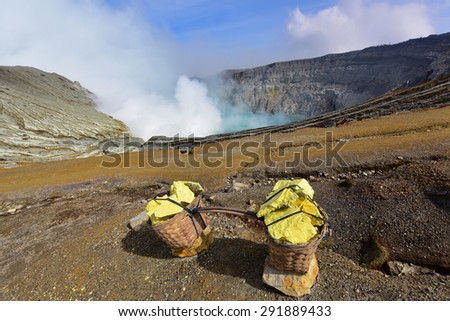 Kawah Ijen volcanic crater emitting sulphuric gas still used for sulphur mining in East Java, Indonesia