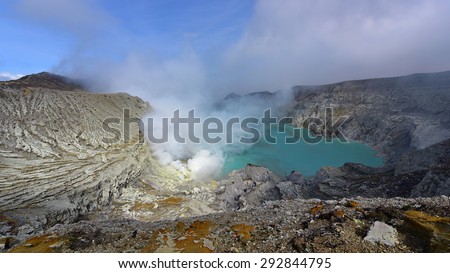 Kawah Ijen volcanic crater emitting sulphuric gas still used for sulphur mining in East Java, Indonesia